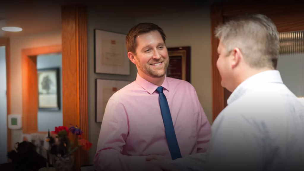 Dr. Richard Salm and the friendly dental team at Smiles for Miles Family Dentistry welcoming a patient in Brookfield, WI